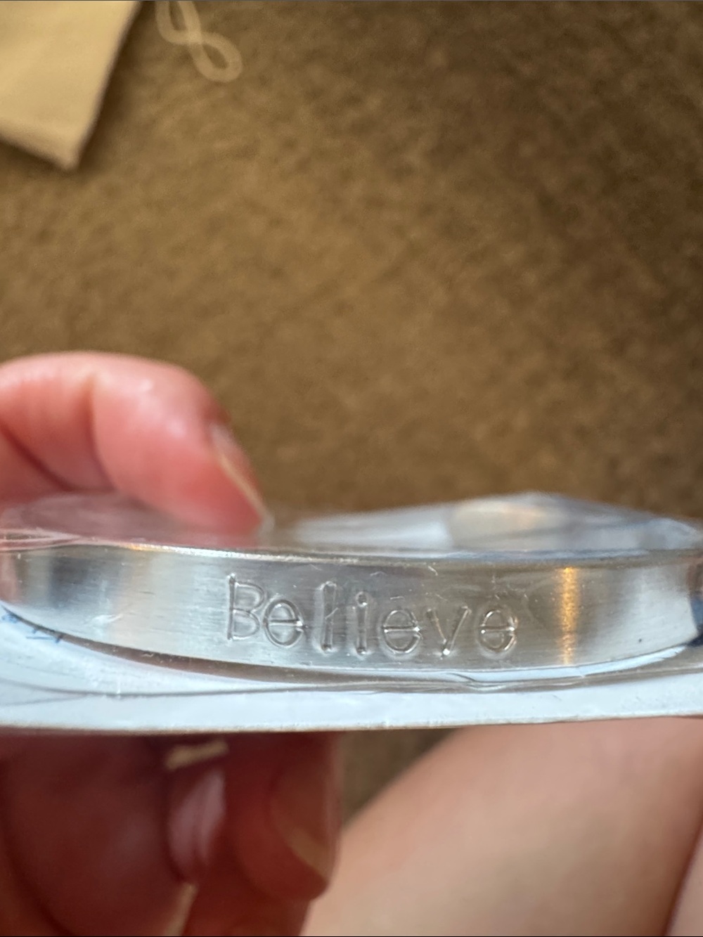 Hand stamped silver cuff bracelet with "Believe"